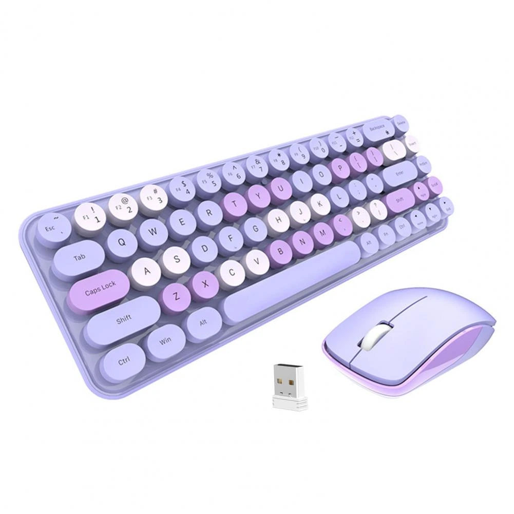 Wireless keyboard set in cream color beside a laptop